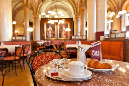 A brightly-lit café with classic renaissance era interior design